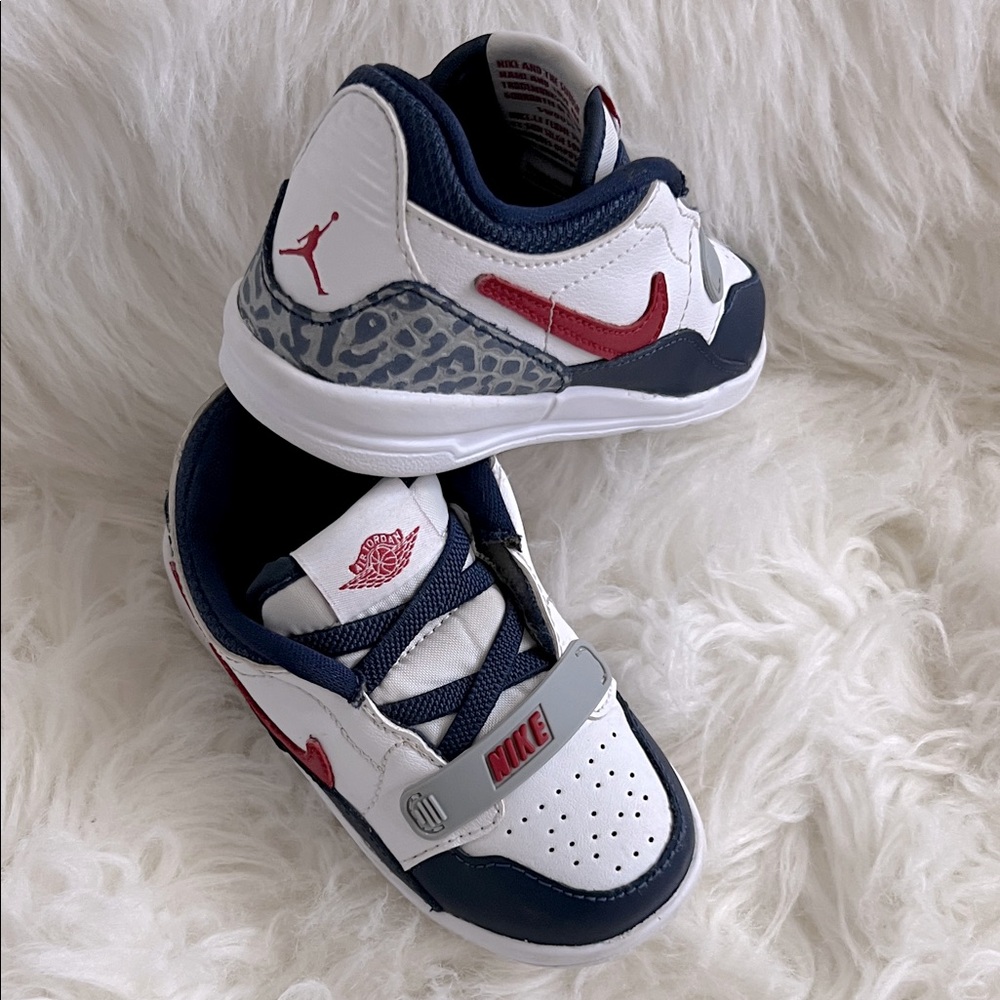 Nike Kids' Air Jordan Legacy 312 Low Sneaker
White and Navy Sneakers